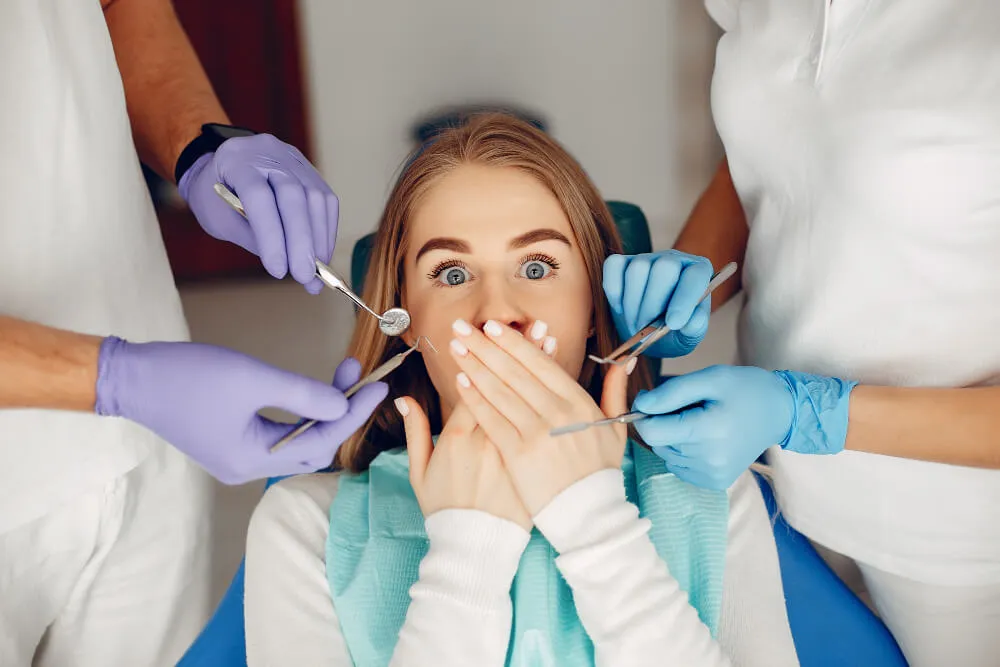 Beautiful girl sitting at dentist's office